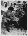 Edward R. Murrow, Mary Marvin Breckinridge, William L. Shirer, putting on ice skates in Amsterdam, 1940-01-19